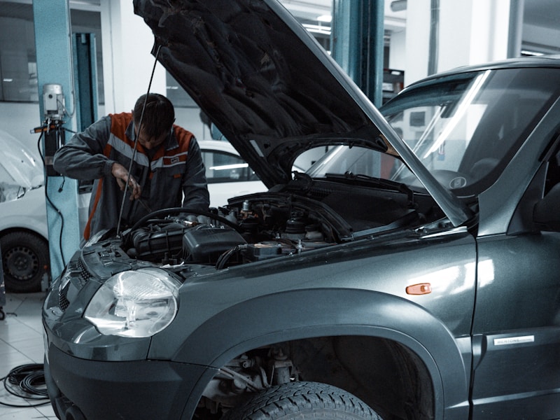 Expert technician diagnosing vehicle